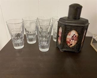 Heavy larger style shot glasses and very unique heavy metal decanter, with decorative ceramic panels 