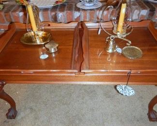 Cocktail table with two glass tops that are trays that can be removed for serving