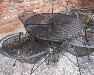 Wrought iron patio set with table and four chairs