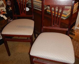 Four folding upholstered seat chairs