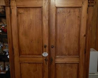 Armoire that can be used as entertainment center, in a bedroom (has shelves) and in a kitchen for storage