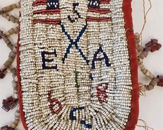 Sioux Beaded Pouch Bag US Flags Insignia Design. The number 68 may be associated with the Red Cloud's War (1866-1868) which culminated in the Treaty of Fort Laramie in 1868. The American flags and number 5 may refer to the 5th Cavalry, which participated in that war. Further research is needed to substantiate that provenance. Beaded on canvas. Missing some of the edge beads. 7" x 3 1/2".