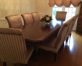 Elegant large pedestal wood table with 8 silk upholstered chairs - set is $1500.00