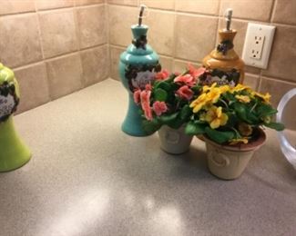 Bottle on left & matching bottle in right are $15.00 each. Flower pots are $12.00 each
