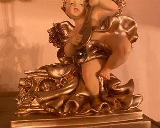 Vintage cherub figurine with lute