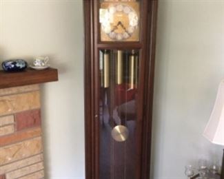 Howard Miller grandfather clock. Keeps good time and chimes properly