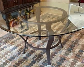 Glass Top Iron Frame Dining table w- 4 upholstered Chairs	Table: 3in H x 56in Diameter	
