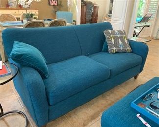 $625 - Lazy boy Comfy teal colored two cushioned sofa. $325-Lazy boy teal ottoman from. 