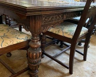 Vtg. ornately carved buffet, table and 6 chairs