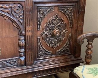 Vtg. ornately carved buffet, table and 6 chairs