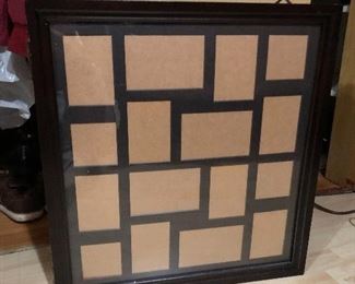 Wall hung picture frame that opens into jewelry storage......