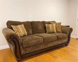 Traditional styled sofa with pillows 