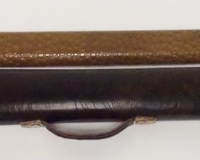 1050 Schmelke Cue and Two Vintage Tube Cases Schmelke cue; butt: 28 1/2", 14.6 oz; shaft: 29 1/2", 5.7 oz, 12.8mm; total length is 58"; total weight is 20.3 oz; linen wrap; straight; includes vintage 1x2 vinyl tube case (possibly Brunswick), holds 1 butt and 2 shafts, and a vintage simulated aligator vinyl 1x2 tube case with Fellini type latch