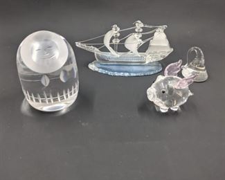 Glass Eskimo, boat, flying pig, and kiss