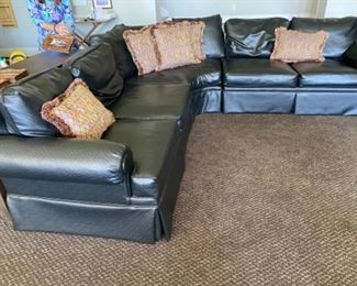 1/ $395 Henrendon black vinyl wrap around sofa 9'4" x 39"deepx 3' T