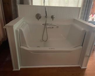 Newly installed Koehler rising wall bath