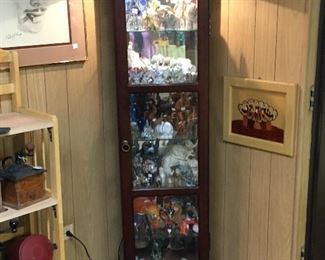 CURIO CABINET SHOWING SOME OF THE ELEPHANT COLLECTION