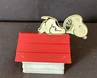 Vintage "1958" Snoopy on top of doghouse pencil sharpener. $10