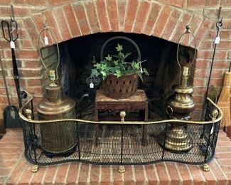 Black and brass colored fire fender; fireplace tools