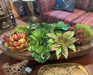 Artificial succulent arrangement in antique wooden dough bowl