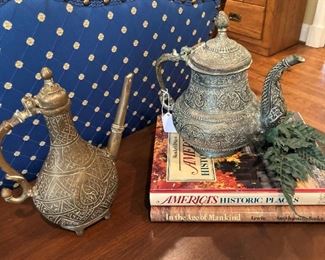 Brass teapots; coffee table books