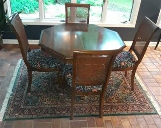 Octagonal table 42" x 42" with two 14" leaves. From game table to dining table