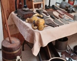 antique washboards, cleavers, jugs and butter churn
