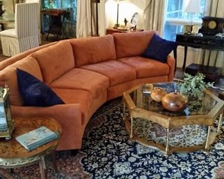 Beautiful curved sofa and glass top coffee table