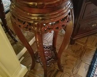 One of several carved stands