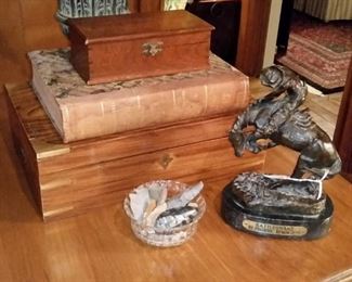 Box with brass hardware, bowl of arrowheads, and Remington's  'The Rattlesnake' bronze statue
