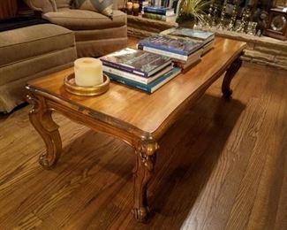 The coffee table matches the two end tables