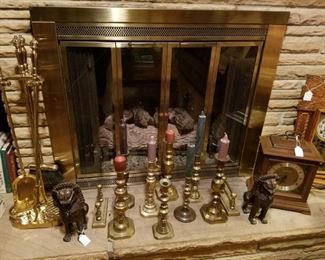 Brass fireside set, brass candle holders, and pair of solid bronze foo lions