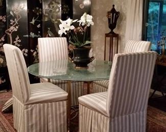 Beautiful shattered glass dining table on brass base and four dining chairs