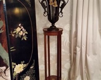 One of two matching stands and urns