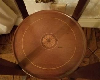 The stands have inlaid designs