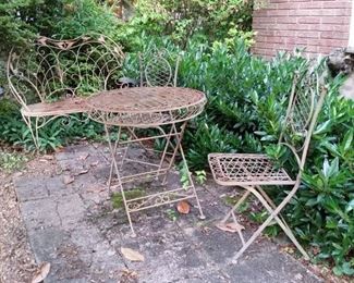 Four piece wrought iron patio set