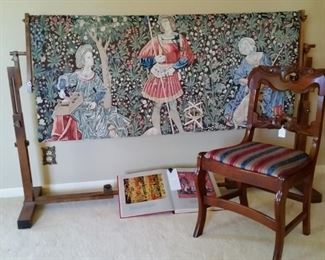 Needlework tapestry kit includes loom, mesh, yarn, and needle.