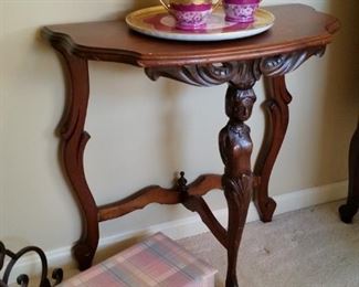 Vintage three legged carved mahogany accent table
