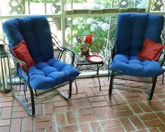 Two matching wrought iron patio chairs.  [All  cushions sold separately]