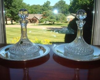 Dining Room:  This is a closer photo of the two WATERFORD crystal ship's decanters.  Each is separately priced, as are the silver-plate platters.