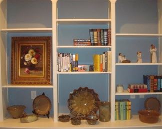 Family Room:  The bookcase on the right has a still life floral painting; books; three WILLOW TREE figures; another "R. J. Hill" duck decoy; and several pieces of pottery (i.e., McNeill's, Owens, and Sandra O'Quinn).