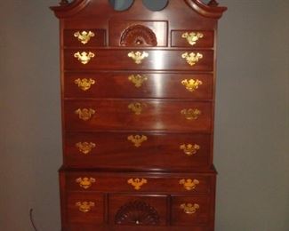 Master Bedroom: You can never have too much storage. This High-Boy with eleven drawers features carved fans and finials. This piece measures 37” wide x 19-1/2 inches deep x 81 inches tall to the top center finial.  (By the way, the finials are removable.)