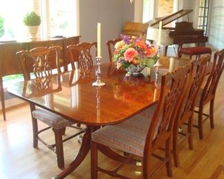 Dining Room: This “HICKORY CHAIR” dining table is priced with six armless chairs. The table measures 6 feet long x 3 feet 10 inches wide and has two 22 inch leaves. Custom pads are included.  The colorful floral arrangement and pair of sterling candlesticks are also for sale.