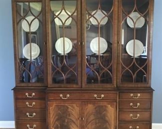 Dining Room: This beautiful “HICKORY CHAIR” lighted China cabinet has four glass doors on top, four shallow drawers on each side and one center drawer, with a felt silverware liner, over two doors. This piece measures 74 inches wide x 16 inches deep x 86 inches high.