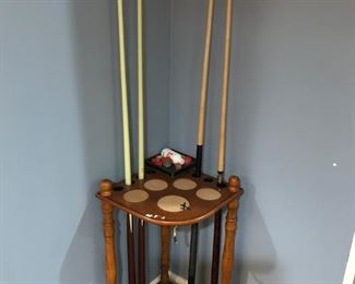 Lower Level:  The stand and the cue sticks [as well as the items already shown on the pool table] and the pool table cover are included in the pool table price.