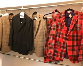 Master Bedroom-Closet:  Some of the men's clothing includes:  a red plaid sports coat and slacks by "Oppo-Suits"; and three Brooks Brothers sports coats. Nearby but now shown are sport shirts and a nice NORTH FACE jacket.