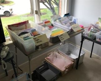 Bedroom #1: Time to stock up on paper supplies: table cloths, napkins, stationery, envelopes, and party bags.  Nearby are office and craft supplies.
