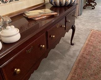 Chippendale wood buffet, Middle Eastern Artwork, Italian pottery. Many exceptional rugs throughout the home.
