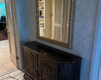 Asian inspired cabinet with large mirror