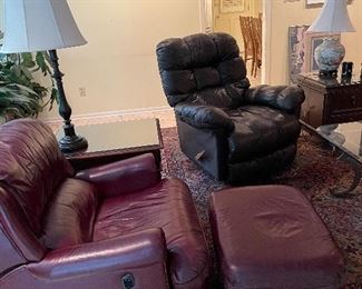 Leather recliner club chairs with matching ottoman. Leather recliner, various lamps. Side tables with glass tops